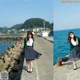 A woman standing on a pier next to the ocean.